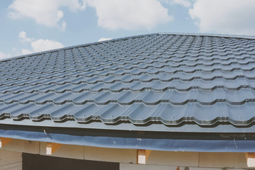 Corrugated metal roof and metal roofing. Modern roof made of met