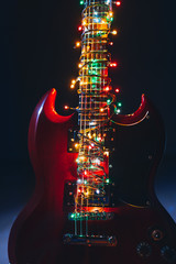 electric guitar with festive Christmas lights