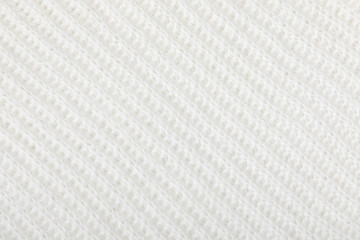 Fototapeta premium Knitted wool texture background. White knitted warm winter sweater. Winter concept. Flat lay, top view, copy space