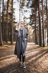 Blonde girl in a coat - autumn walk, fashion style and freedom