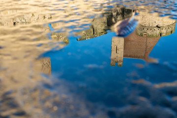Reflection in the hole of the castle silhouettes Cite de Carcassonne. France