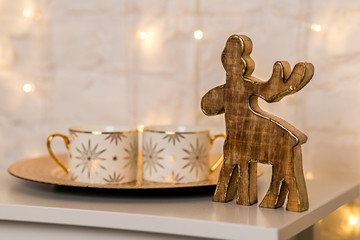 Christmas decorations, two cups and wooden moose
