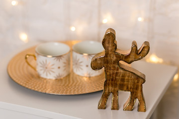 Christmas decorations, two cups and wooden moose