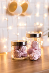 Interior Christmas decorations, jars with pink marshmallows