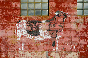 Cow painting on side of dairy barn