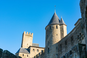 Fototapeta na wymiar Medieval fortress Cite de Carcassonne in the morning rays of the sun. Carcassonne, France. 26 nov 2019