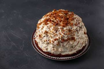 Pancho Cake with Sour Cream, Walnuts, Prunes and Chocolate on dark background, horizontal orientation