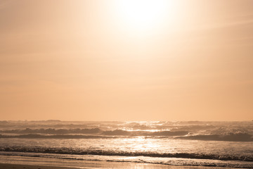 Obraz premium Sandy ocean coast at sunset. Atlantic Ocean, Morocco