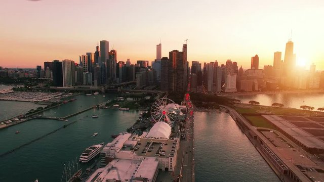Aerial footage of downtown Chicago and Navy Pier during sunset
