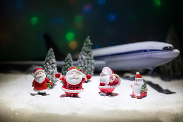 Merry Christmas and Happy new years travel concept background for winter trip on wood background , Travel with airplane top view with copy space.