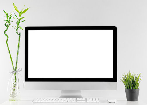 Computer all in one in office table with isolated white screen