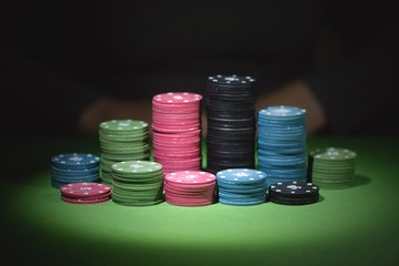 Woman hands and poker chips close up.
