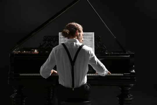 Man playing grand piano at the concert