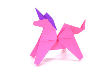 Unicorn. Pink unicorn origami paper art isolated on white background. Ideas for DIY hobby (Do It Yourself) for Children.                                 - obrazy, fototapety, plakaty