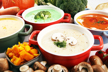 Variety of colorful vegetables cream soups and ingredients for soup. Concept of healthy eating or vegetarian food with mushrooms
