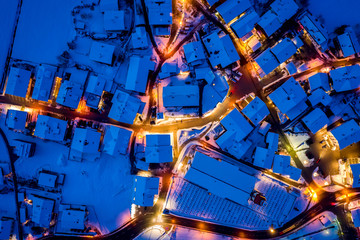 Aerial view of the town center of Neustift. Night illumination of houses and traffic light. Tyrol, Stubai Valley