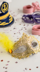 Golden carnival mask close-up on white background