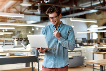 Always work to be more perfect. Young businessman posing in office