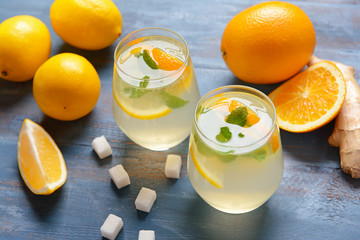 Glasses of tasty lemonade on table