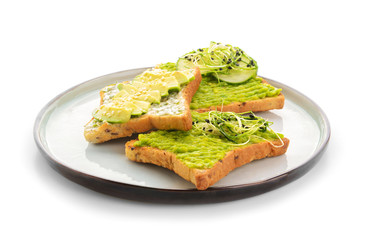 Plate with tasty avocado sandwiches on white background