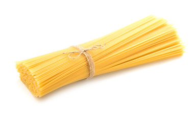 Tasty uncooked pasta on white background