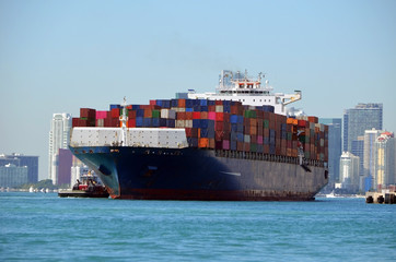 A container sip being guided by our boats into an unloading pier.