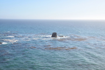 Lone rock among kelp in Big Sur, the beautiful and rugged Californian coast along Route 1, California