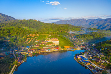 Aerial landscape of Ban Rak Thai with sunrise in the morning located in Maehongsan province, Thailand.