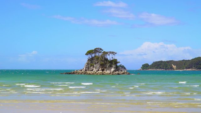 Small island in front of coast at Abel Tasman National Park