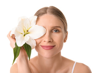 Beautiful woman with flower on white background. Spa treatment