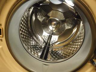 Washing machine open door, we can see drum shiny inside