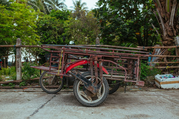 Fototapeta na wymiar Old Motorbike Trailer for goods transportation in Asia