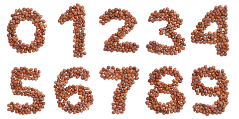 Arabic numerals   from  peeled hazelnut  on a white isolated background. Food pattern made from nuts. bright  numeral for design.