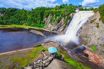 Landscape View of Montmorency Falls and Magnificent Rainbow in Montmorency Falls Park, Quebec, Canada