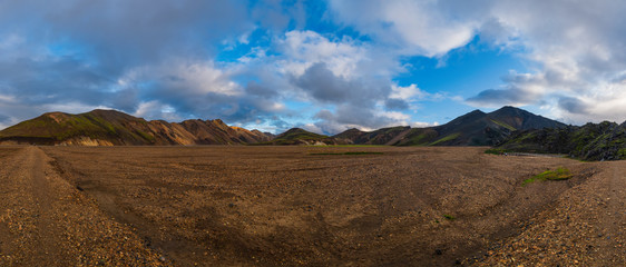 Iceland in september 2019. Great Valley Park Landmannalaugar, surrounded by mountains of rhyolite and unmelted snow. In the valley built large camp. Evening in september 2019