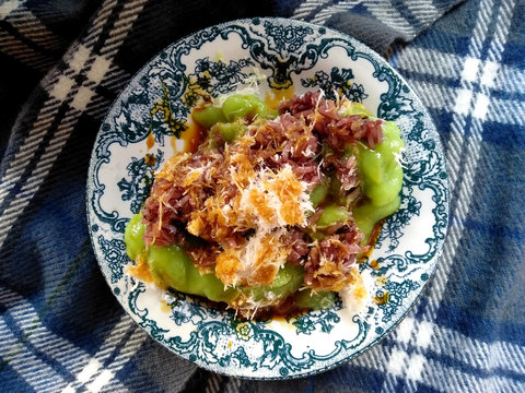 Bubur Sumsum Ijo Bali or marrow porridge. Makanan Bubur khas bali or Balinese specialty porridge. porridge added with sweet sugar and jaje injin. traditional indonesian culinary food.