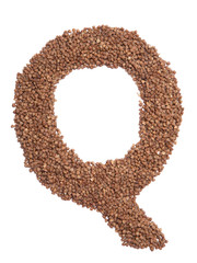 Letter Q of the English alphabet from  brown dry buckwheat  on a white isolated background. Food pattern made from groats. Bright alphabet for shops.  Buckwheat for porridge
