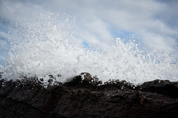 Waves crashing over rocks