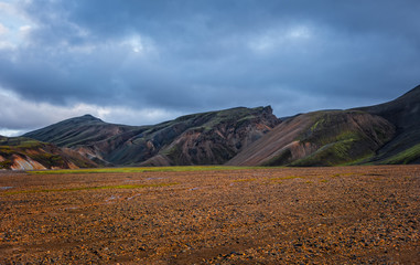 Iceland in september 2019. Great Valley Park Landmannalaugar, surrounded by mountains of rhyolite and unmelted snow. In the valley built large camp. Evening in september 2019