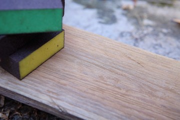 Sandpaper for polishing wood Laying on a wooden plate.
