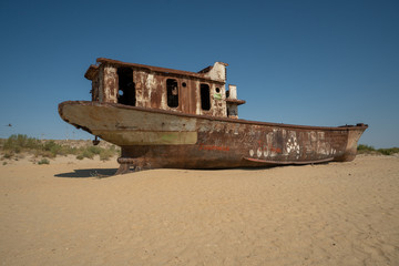 Rusty ship wreck in the deserted Aral Sea near Muynak en Uzbekistan