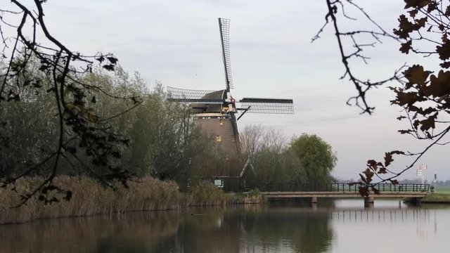 Dutch windmill with small lake in front, Oude Leede, the Netherlands