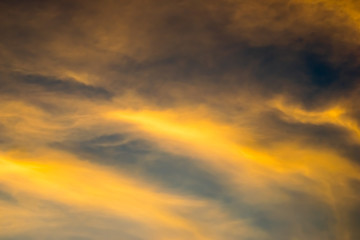 Blue and golden sky with many clouก background, twilight sky after sunset.