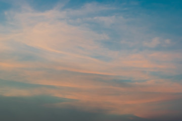 Blue and orange sky with many cloudy background, twilight sky after sunset.