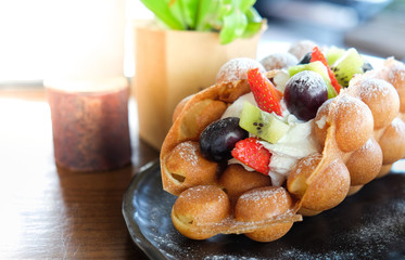 Delicious sweet bubble waffles fresh fruit and cream