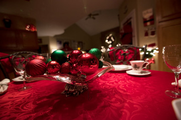 festive table setting with bowl of ornaments