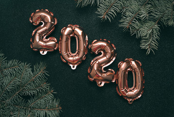 Shiny symbols 2020 on festive background.