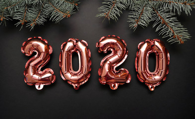 Shiny symbols 2020 on festive background.