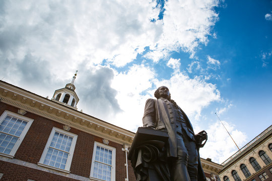A statue of George Washington in front of Independence Hall