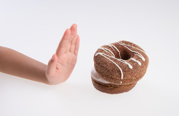 Donut or Donuts with hand on a background new.